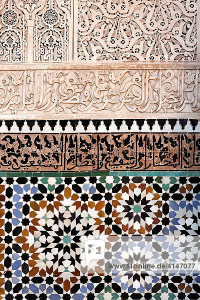 Tile wall decorated with ornate arabesque designs  Ali-Ben-Youssef madrasah  historic theological academy in the Medina quarter  Marrakesh  Morocco  Africa