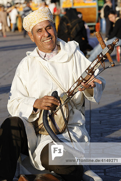 Berber musicians playong traditional arabic lute. at Djemaa el-Fna  Marrakech  Morocco  Africa