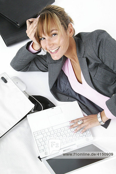 Laughing woman with laptop