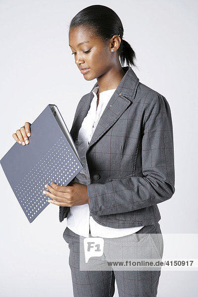 Young woman holding folder