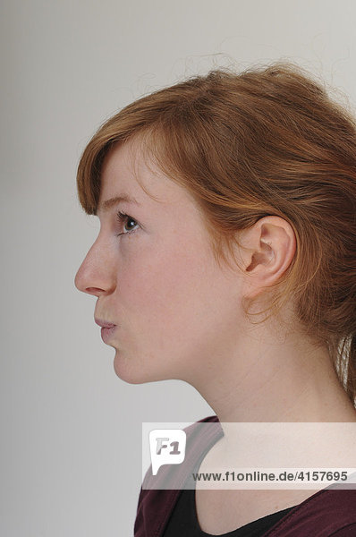 Profile of a young woman  redhead