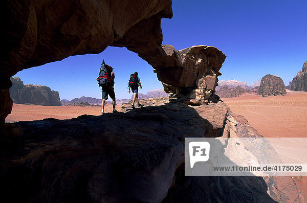 Trekking  stone arch  Wadi Rum  Jordan  Asia