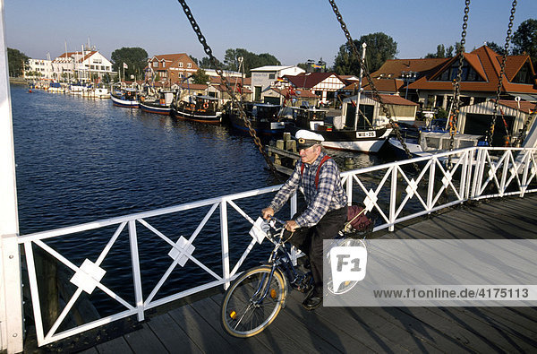 Biker  wooden draw bridge  Wieck  Greifswald  Baltic Sea  Mecklenburg-Vorpommern  Germany