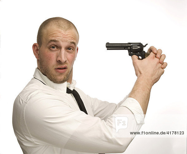 Young man holding toy gun