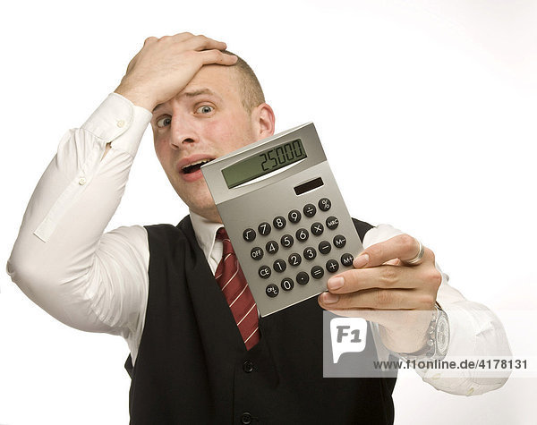Young man holding a calculator