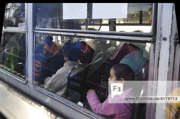 Child in a public transit bus  Mexico City  Mexico  North America
