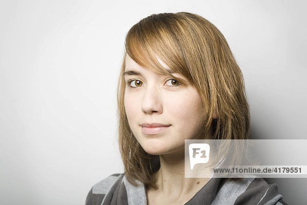 Young woman looking into the camera  friendly