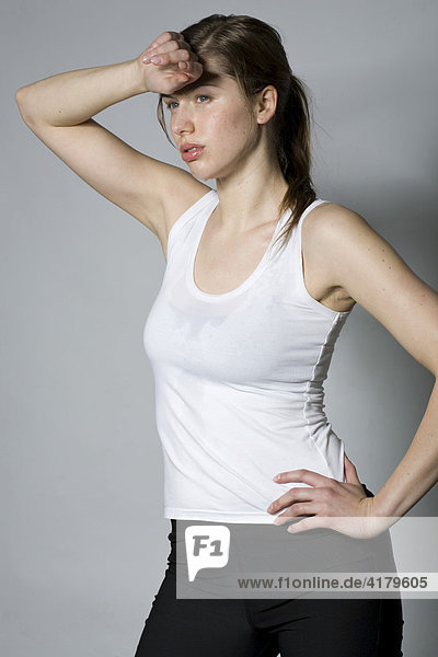 Young woman exhausted after a work-out