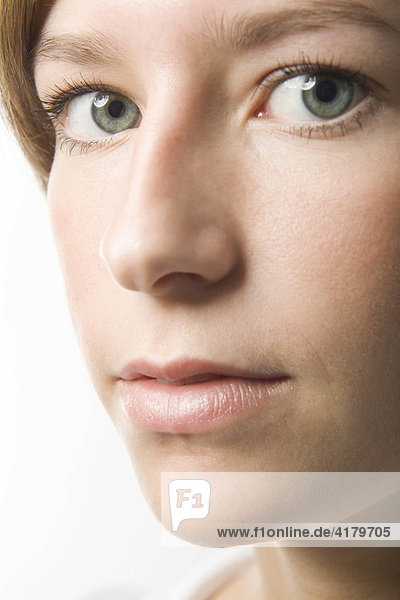 Closeup headshot of a young woman's face