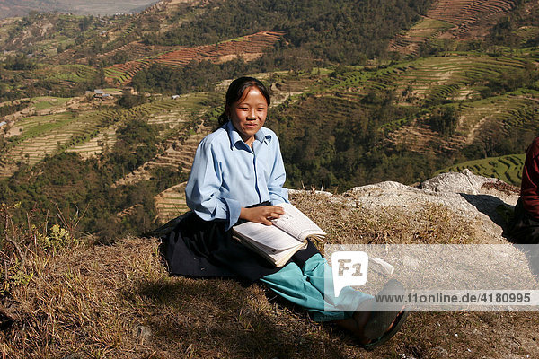 Schoolgirl wearing school uniform in the countryside near Nagarkot  Nepal  Asia