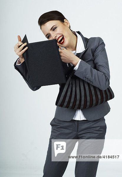 Young businesswoman  female manager with purse laughing while talking on the phone