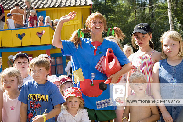 Actress impersonating Pippi Longstocking interacting with kids at the Villa Villekulla  Astrid Lindgren's World amusement park  Vimmerby  Sweden  Scandinavia  Europe