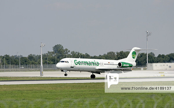Muenchen  DEU  11.08.2005 - Ein Jet des Typs Fokker F100 der GERMANIA landet auf dem Muenchner Flughafen.
