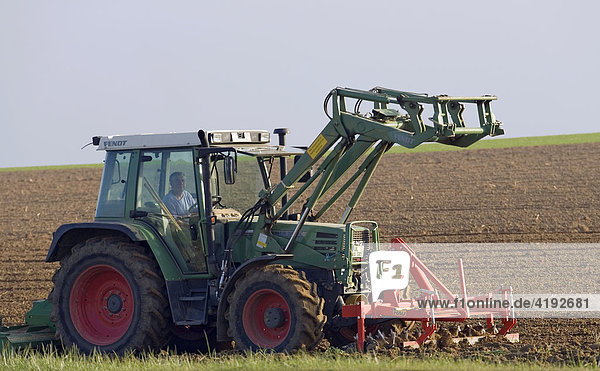 A tractor ploughs