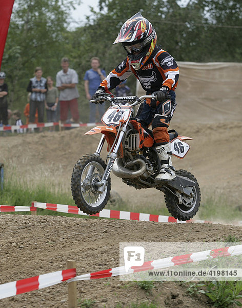 A child driving motocross