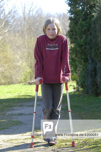 Girl walking on crutches