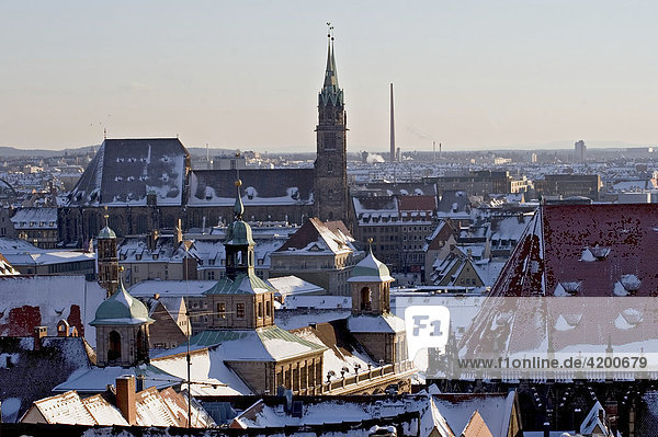 View from the castle over the snow-covered roofs of the city  direction old townhall and St.Lorenzchurch Nuremberg  Bavaria  Germany