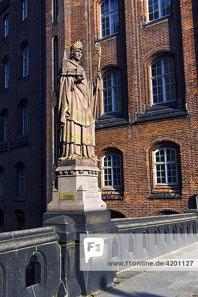 Statue of St. Ansgar on the Trostbruecke Bridge and Patriotic Society building  Hamburg  Germany  Europe