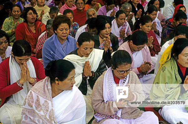 Woman gathered for a puja  praying for world peace  Pokhara  Nepal  Asia