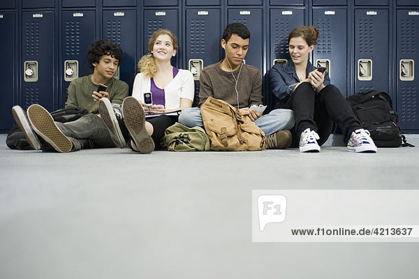 High school students hanging out in school corridor