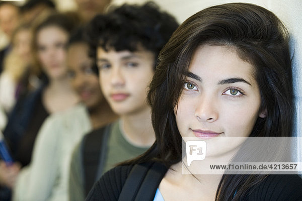 Teenage girl waiting at front of line  portrait
