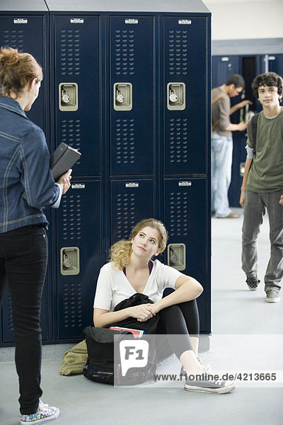 High school students chatting by lockers