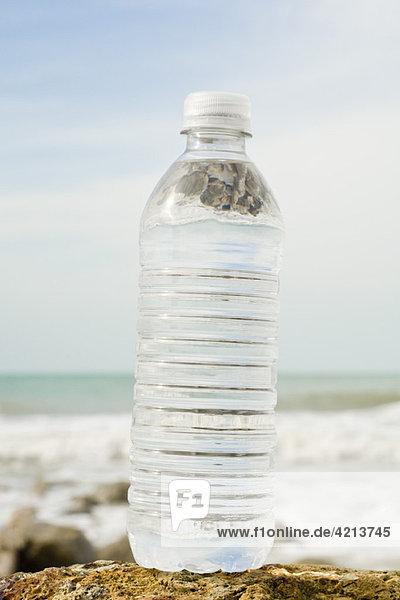 Bottle of water on shore