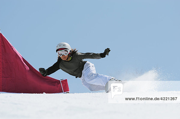 Woman Snowboarder at Giant Slalom