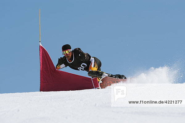 Snowboarder at Giant Slalom Race