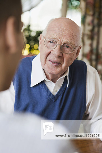 Elderly man in discussion