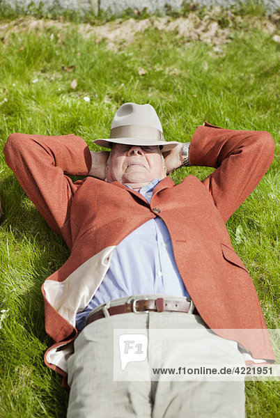 Senior resting in the grass