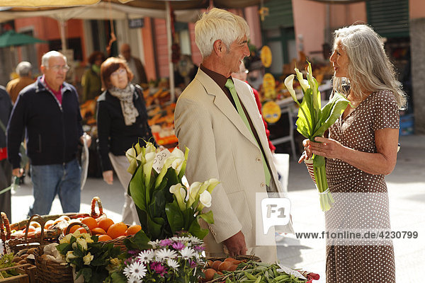 Senior couple at a market stall  Italy  Rapallo