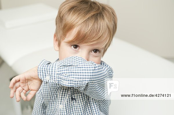 Boy with cough in medical practice