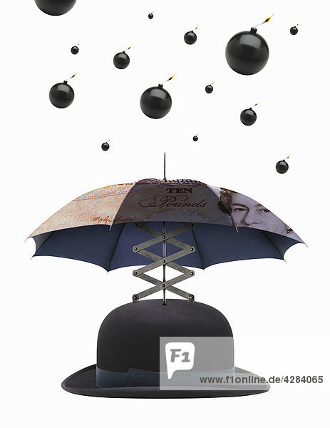 Bomben fallen auf Regenschirm über Filzhut