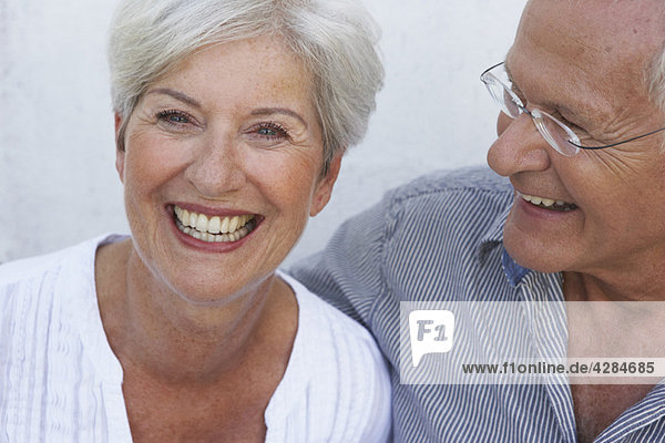 Senior couple smiling close-up