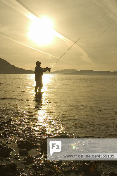 Man Flyfishing Shoreline of Sitka Sound SE AK Summer Near Harbor Pt Silhouette