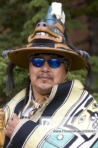 Tlingit Indian from the village of Angoon wearing Brown Bear clan hat member of Daaxaat Kanadaa dance group Alaska southeast Summer