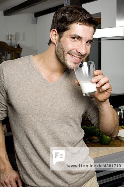 Young man drinking milk