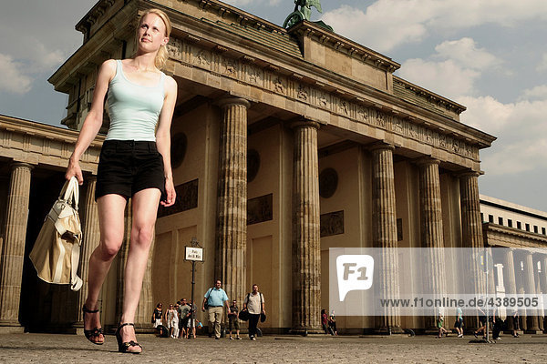 Young woman at Brandenburg Gate  Berlin  Germany  Europe