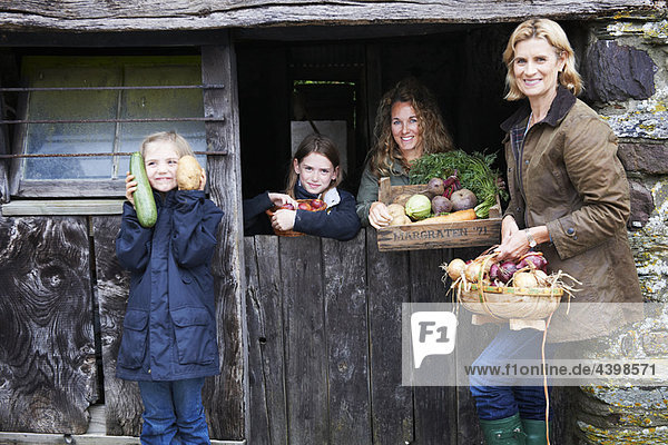 Family with fresh vegetables