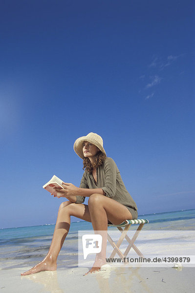 Woman reading on beach