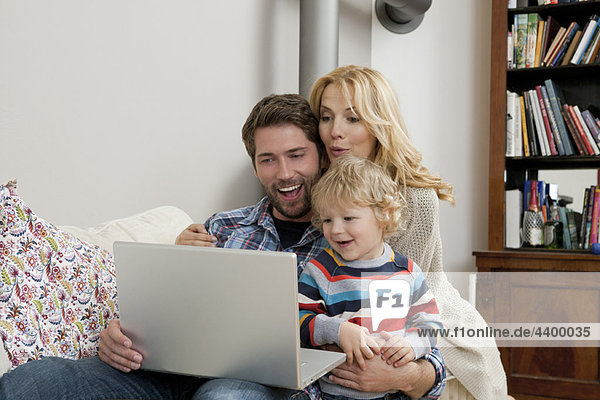 Family in front of computer