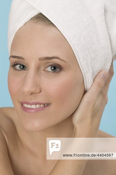 Woman with her hair wrapped in a towel