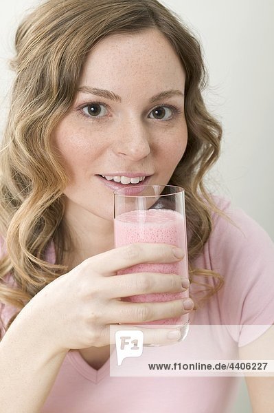 Woman drinking strawberry shake