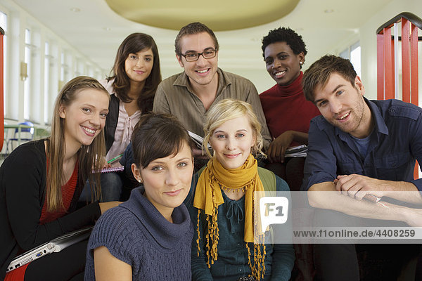 Germany  Leipzig  Group of university students sitting together  smiling  portrait