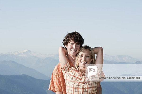 Young couple holding  smiling  portrait.