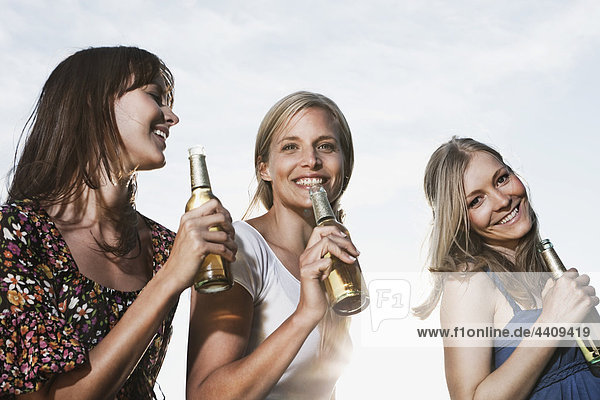 Women enjoying beer  smiling