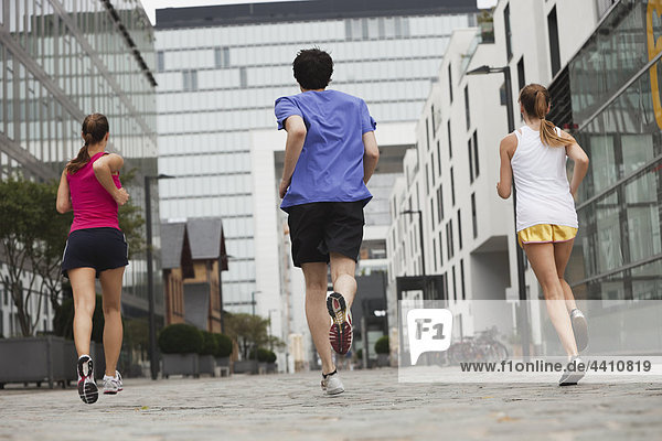 Young man and women jogging