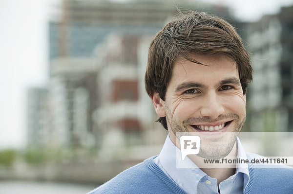 Germany  Hamburg  Businessman smiling  portrait