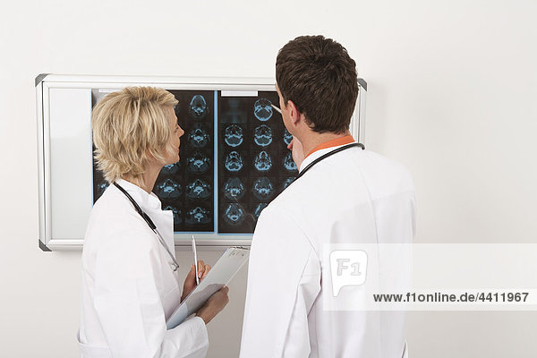 Germany  Munich  Doctor's examining x-ray